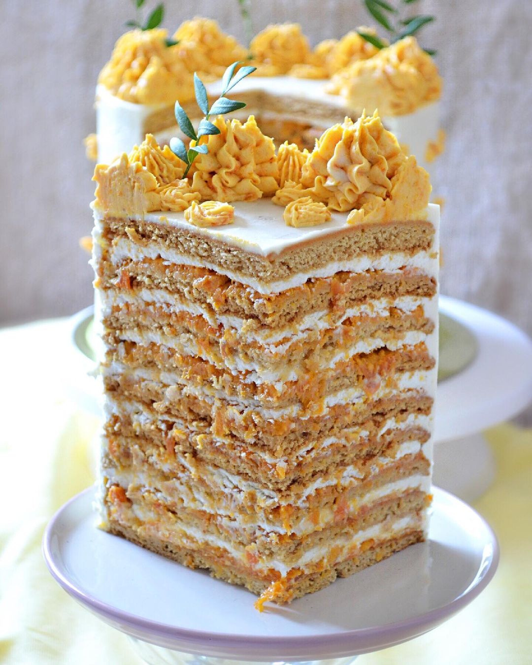 Honey cake with brandy, creamy dried apricots puree, roasted candied almonds & cream cheese