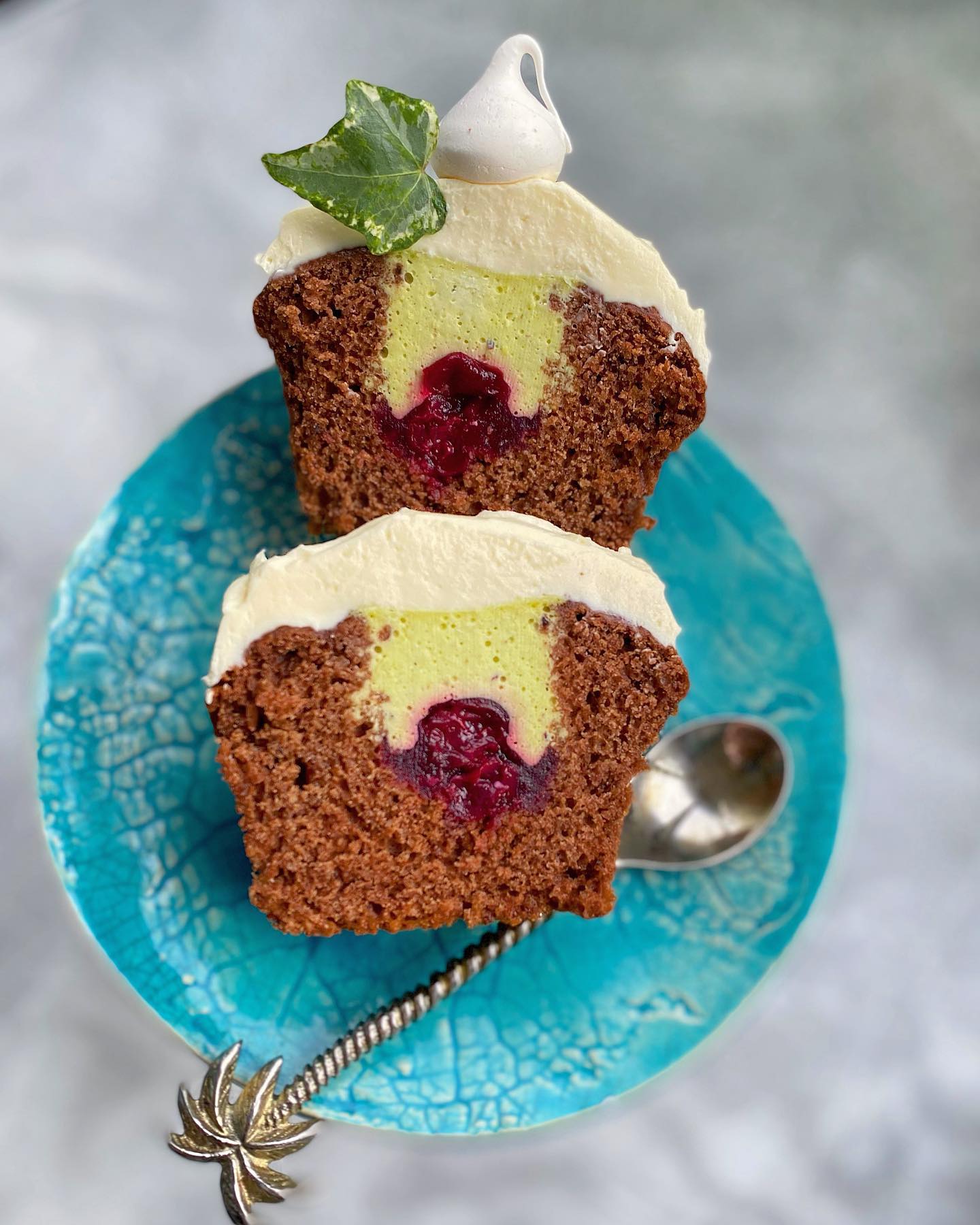 Chocolate muffins with pistachio mousse and berries