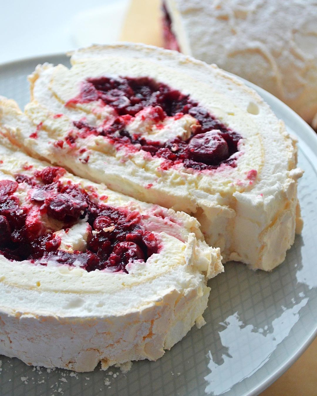 Cherry & lingonberry confit meringue roll