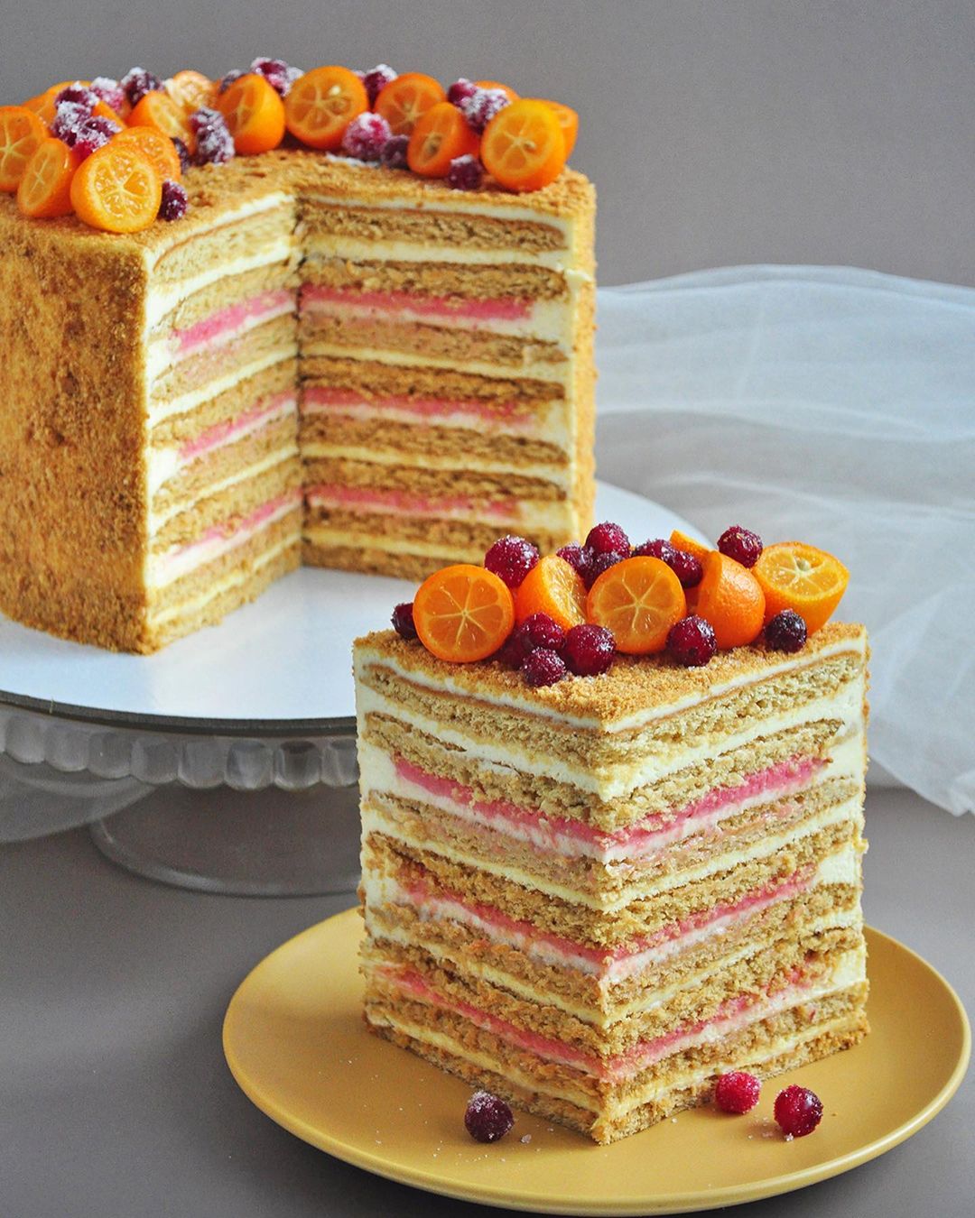 Honey cake with cranberry curd and orange cream