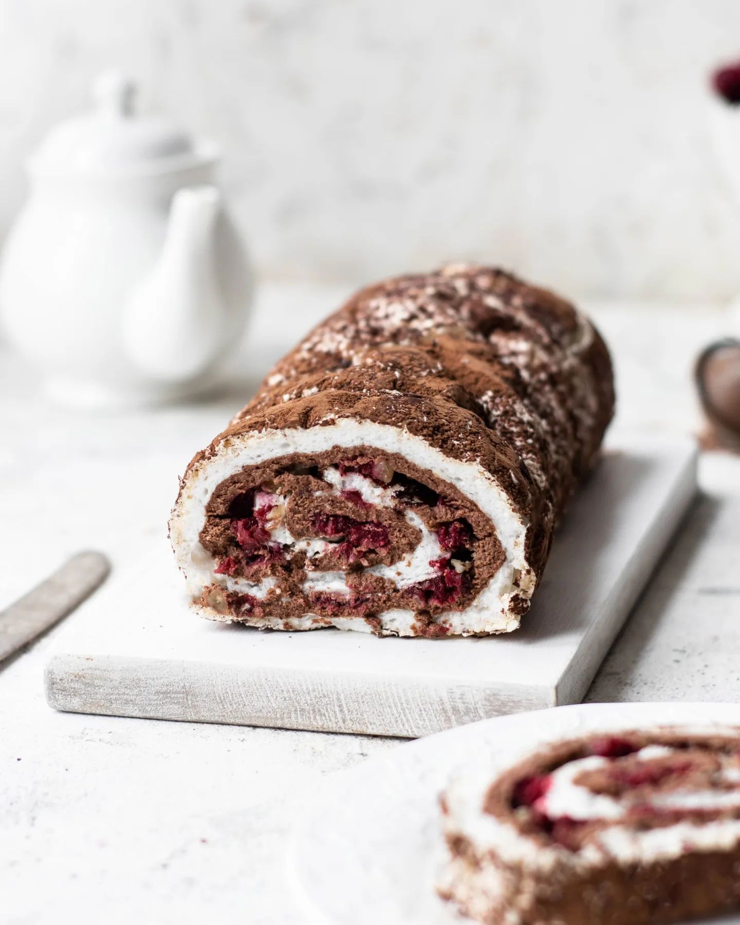 Meringue roll with chocolate, cherry & walnuts