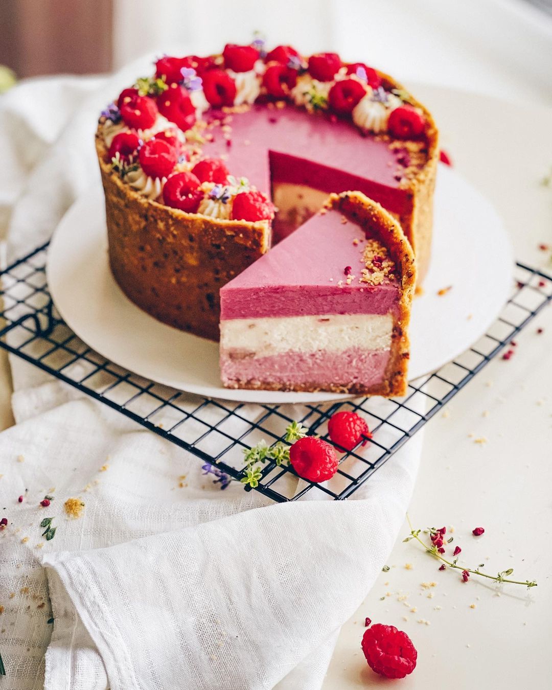 Three-layer raspberry & peanut cheesecake